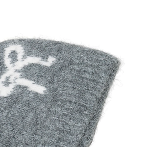 Close-up of soft dark grey knit beanie fabric with detailed white jacquard pattern
