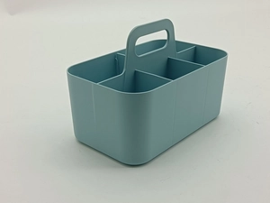 Detail view of light blue plastic organizer with six compartments and central handle