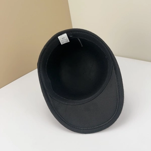 Detail shot of the interior care label showing 100% polyester material for wool felt cap