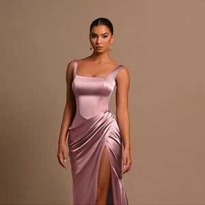 Detail of elegant satin dress showing side pleats and high slit in dusty rose
