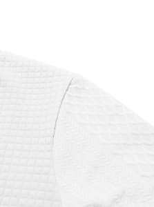 Detailed close-up of white men's jacket showing jacquard texture and seam craftsmanship