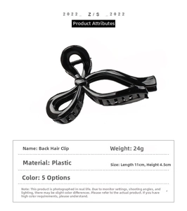 Detail view of a 24g black hollow bow hair claw clip measuring 11cm by 4.5cm