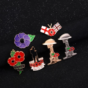 Detail of 6 enamel poppy pins and soldier silhouettes with remembrance engravings