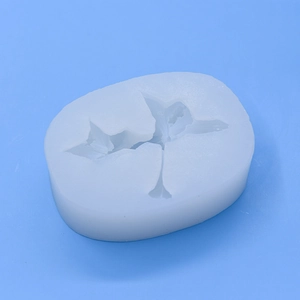 White flower shaped silicone mold for DIY baking and handmade lily crafts on blue background