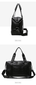 Detail view of large black PU leather travel bag showing side and back zipper pockets