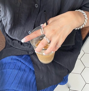 Minimalist 925 sterling silver geometric rings and chunky chain bracelet on hand