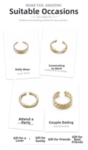 Detail of four gold-plated ring designs with smooth, twisted, and textured finishes