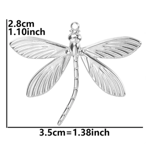 Detailed view of dragonfly pendant dimensions 2.8cm by 3.5cm in polished silver steel