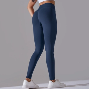 Rear view of high-waisted seamless navy blue yoga pants with peach butt lifting effect