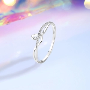 Minimalist S925 sterling silver twist ring with shimmering pave zircons and polished finish