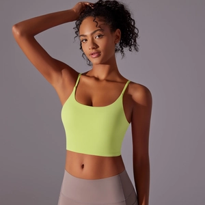 Detail of neon green strapless yoga crop top with thin straps and elastic fabric