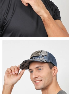 Detail of grey camo mesh baseball cap featuring a flag patch on the front panel