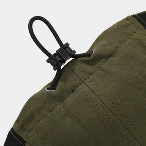 Detail of adjustable windproof elastic drawstring with plastic toggle on army green cap