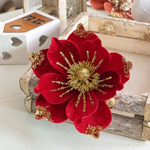 Red velvet Christmas flower decoration with gold glitter accents for holiday trees