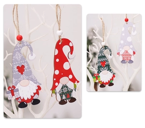 Detail of wooden gnome ornaments with red and green patterns hanging on white branches