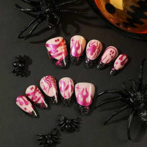 Halloween almond press-on nails featuring black glitter, pink flames and spider web patterns