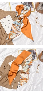 Close-up of retro silk scarf featuring Roman numerals and clock gear patterns