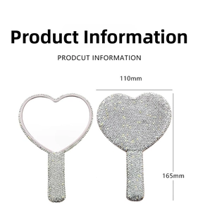 Detailed view of heart-shaped handheld mirror with sparkling rhinestones and size labels