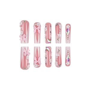 Pink French press-on nails with 3D bows, pearls and crystals in long trapezoid shape