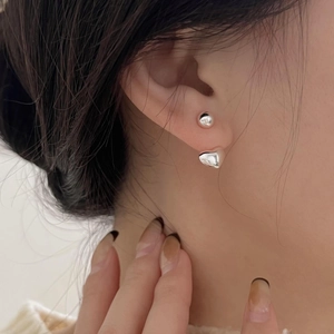 Polished 925 sterling silver heart and bead stud earrings shown on model ear