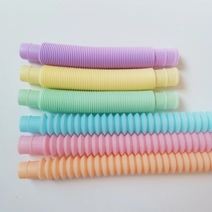 Colorful stretch pop tubes in compressed and extended states for sensory play