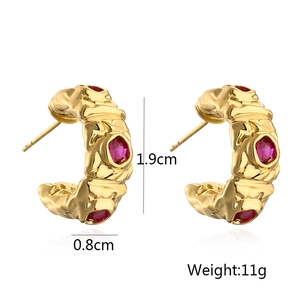Detail view of gold-plated C-shape hoop earrings with red zircon and size specifications