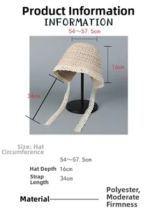 Detailed view of beige crocheted straw hat with lace ties and dimensions.