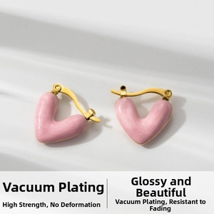 Detailed close-up of pink heart earrings with gold plating and smooth enamel finish