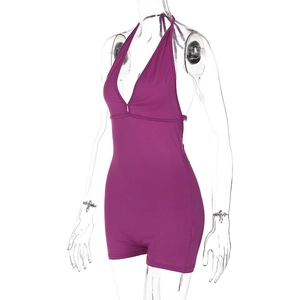 Close-up of purple backless bodysuit with halter neck and shirred elastic fabric
