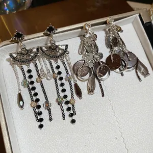 Vintage silver needle earrings with shimmering crystal flowers and long water drop tassels