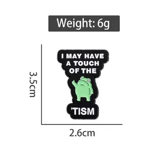 Cartoon frog enamel pin in black and green finish with size dimensions and weight