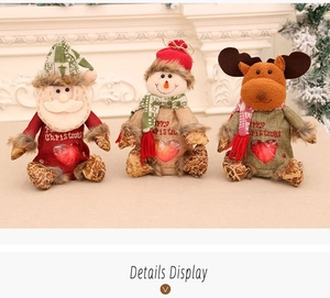 Detail display of linen Christmas gift bags with Santa, snowman and reindeer dolls