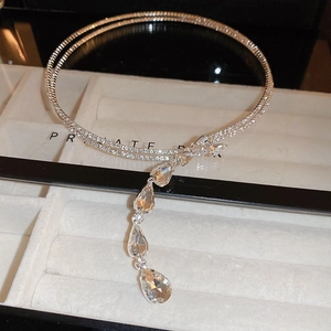 Close-up of silver rhinestone choker with double rings and water drop crystal tassels