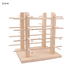 Detail of wooden eyewear display stand with 2x2x4 tiered bars for sunglasses storage