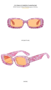 Detail view of pink floral frame sunglasses with champagne lenses in rectangle style