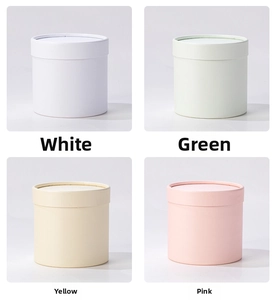 Mini round hug flower boxes in white, green, yellow, and pink colors for DIY floral design