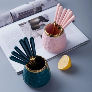Luxe ceramic storage jars with hammered texture and stainless steel spoons set