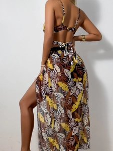 Rear view of tropical palm print bikini top and side slit sheer mesh cover-up skirt