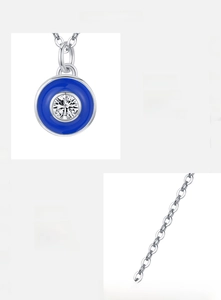 Macro detail of 925 sterling silver evil eye pendant with blue enamel and 5A zirconia stone
