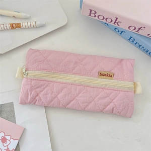 Detail of pink quilted pencil case with Sozakka label and sleek zipper closure