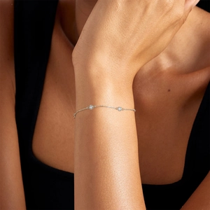 Close-up of S925 sterling silver bracelet featuring two sparkling round cubic zirconia stones