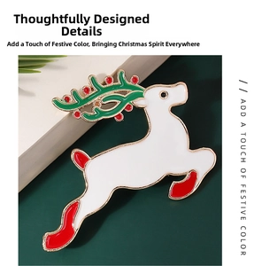 Macro detail of Christmas reindeer brooch with white enamel and golden metal accents