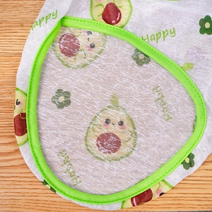 Close-up of breathable mesh fabric with avocado print and vibrant green stitching details