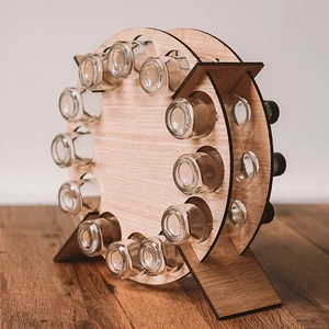 Rotating ferris wheel wooden spice rack with clear glass jars on a tabletop