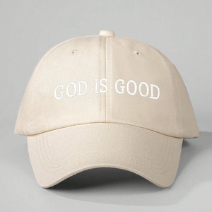 Beige adjustable baseball cap with white 'GOD IS GOOD' embroidery on high-quality cotton