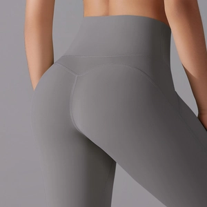 Macro view of high-waist yoga shorts showing seamless texture and butt-lifting seam lines