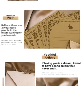 Close-up of vintage kraft paper letter set with rabbit silhouette and floral cutout detail