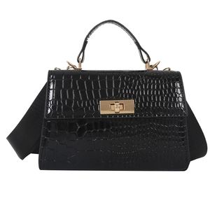 Chic black crocodile embossed crossbody bag with gold lock and wide shoulder strap