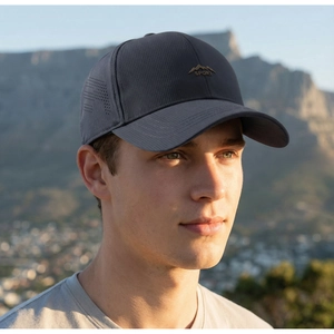 Close-up of laser-cut side vents on a dark grey outdoor sport baseball cap