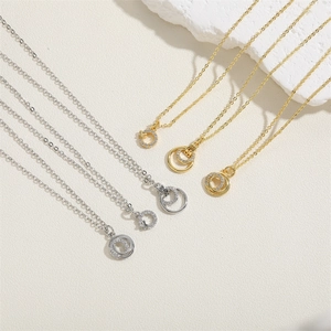 Minimalist geometric zircon pendant necklaces in silver and gold on a stone base